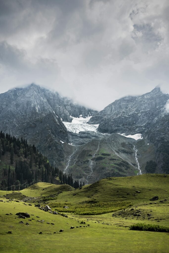 Stunning winter mountain landscape featuring snow and serene meadows in Jammu and Kashmir.