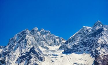 Stunning view of the snow-covered mountains in Sonamarg under a clear blue sky.