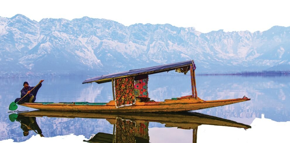 A vibrant shikara on Dal Lake with the stunning Himalayan backdrop, perfect for travel exploration.